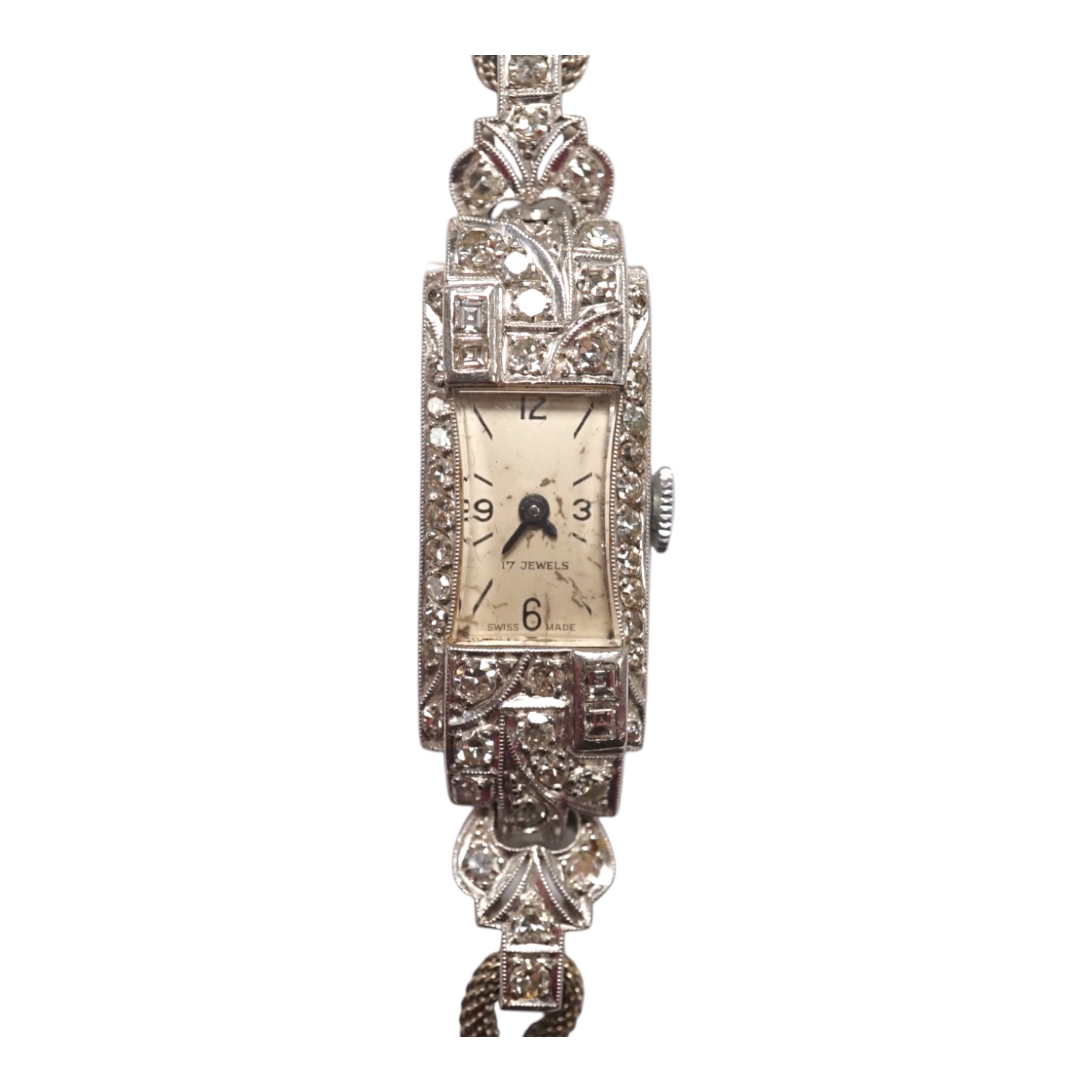 A lady's mid 20th century white metal (stamped platinum) and diamond set manual wind cocktail watch, on a 9ct white metal twin strand bracelet, overall length 16.5cm, gross weight 17.6 grams/ Condition - fair to good